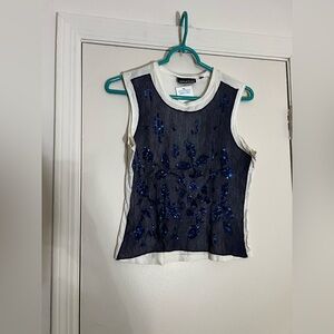 DKNY Navy sequin tank top
Size Small
Small stain shown in photos